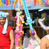 Children engaging in playful battles with the Bubble Gun Sword at a Teddy and Co Funland event.